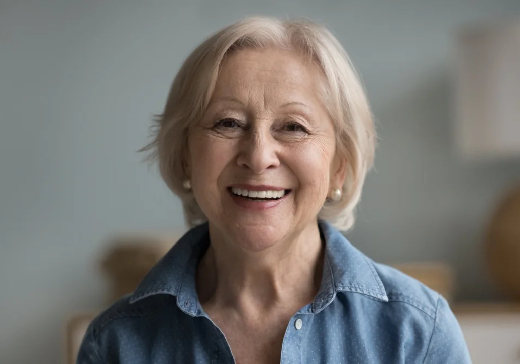 Woman with natural dental implants